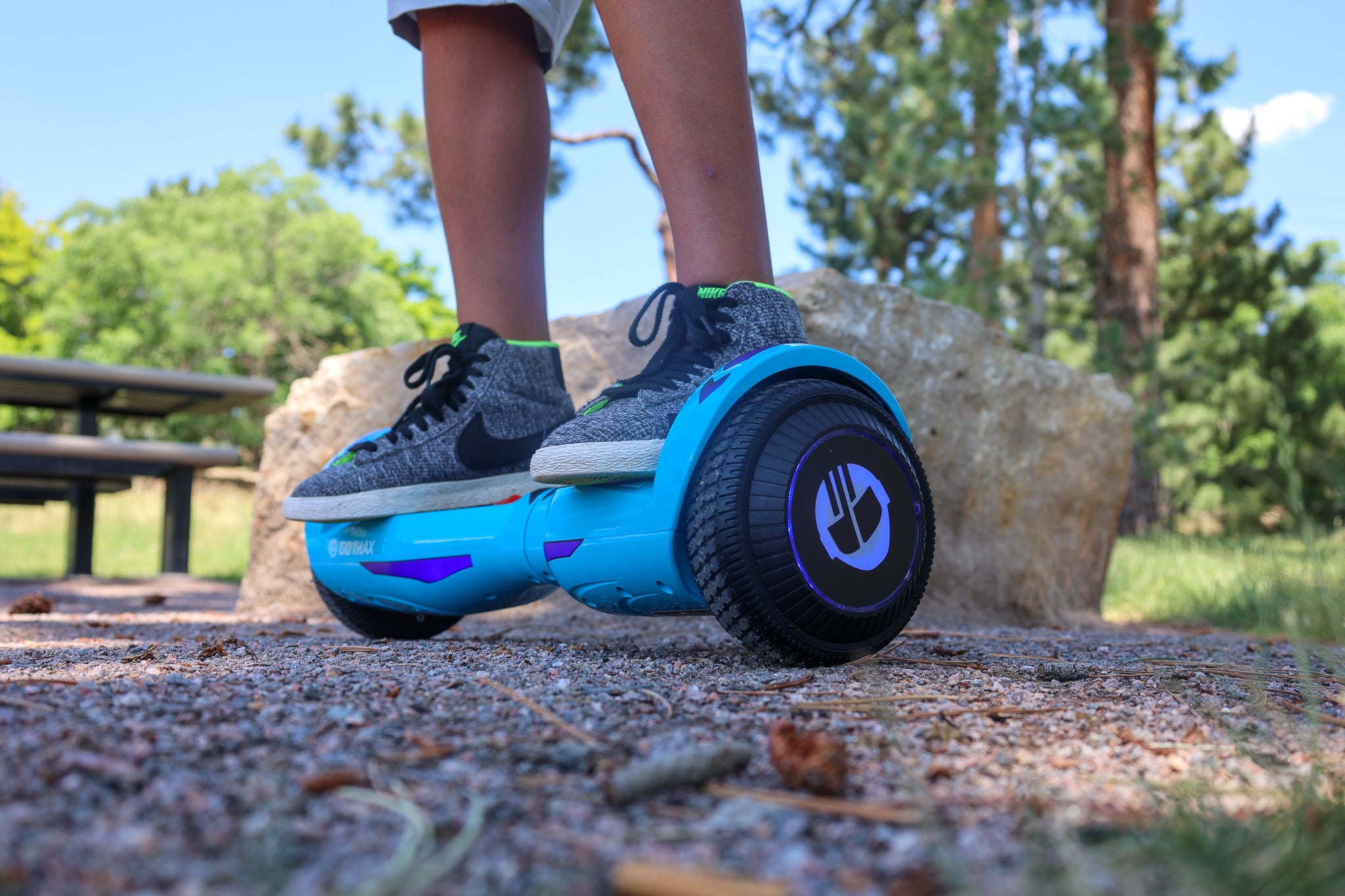 Child riding GOTRAX Blue Nova LED Hoverboard for Kids